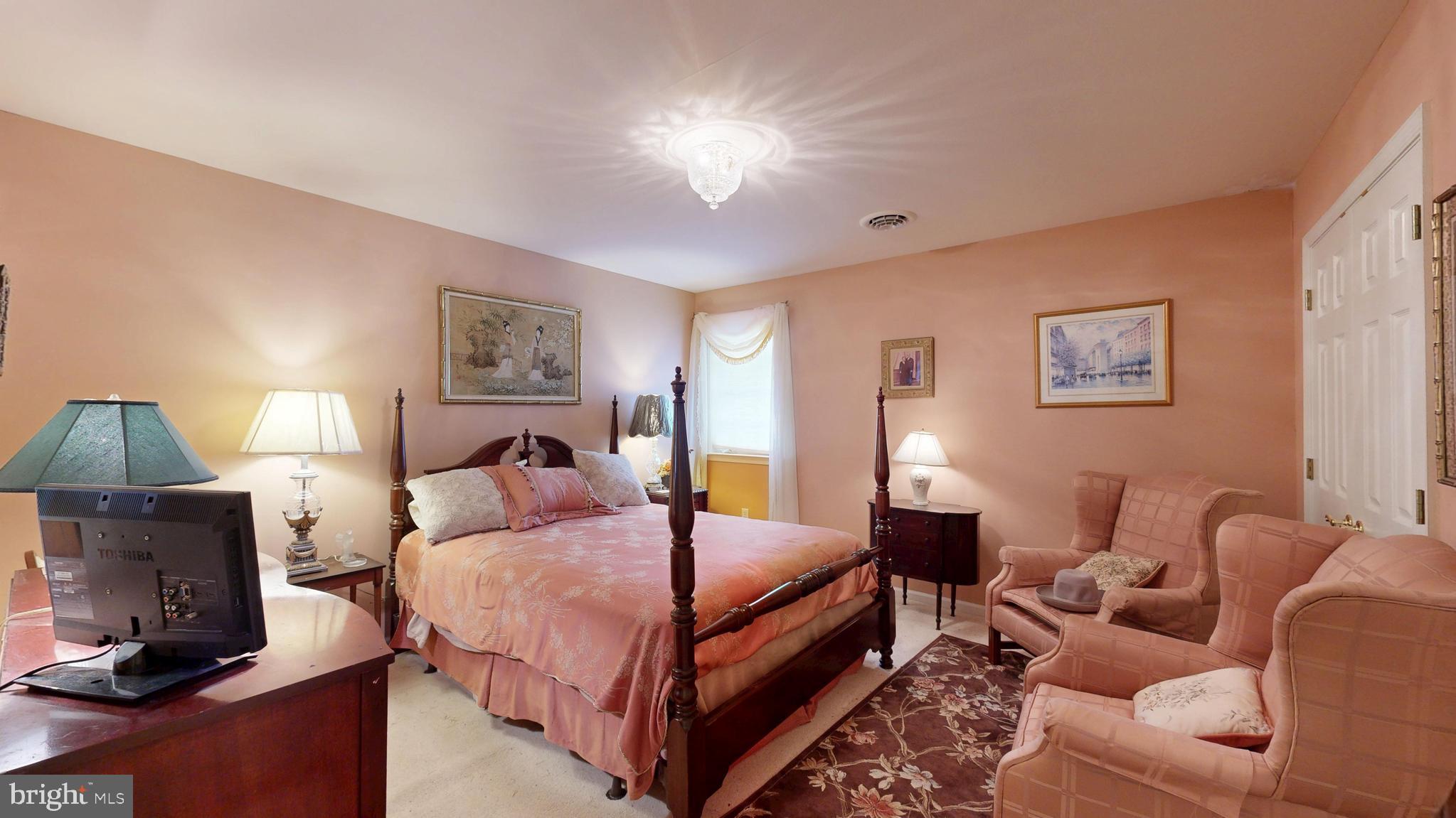 110 Masters Lane Magnolia, DE 19962 - Photo 47 of 65 a bedroom with a bed a couch and dresser