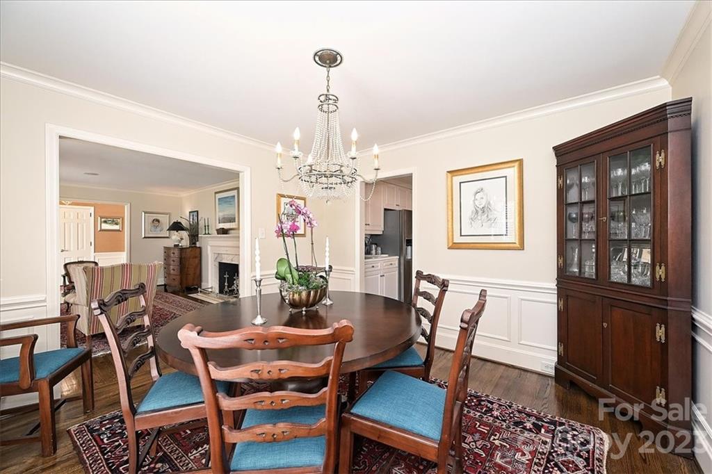 3724 Merrifield Road Charlotte, NC 28211 - Photo 11 of 48 a view of a dining room with furniture and chandelier