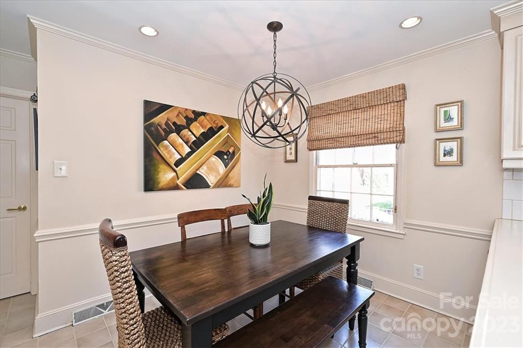 3724 Merrifield Road Charlotte, NC 28211 - Photo 17 of 48 a view of a dining room with furniture window and wooden floor