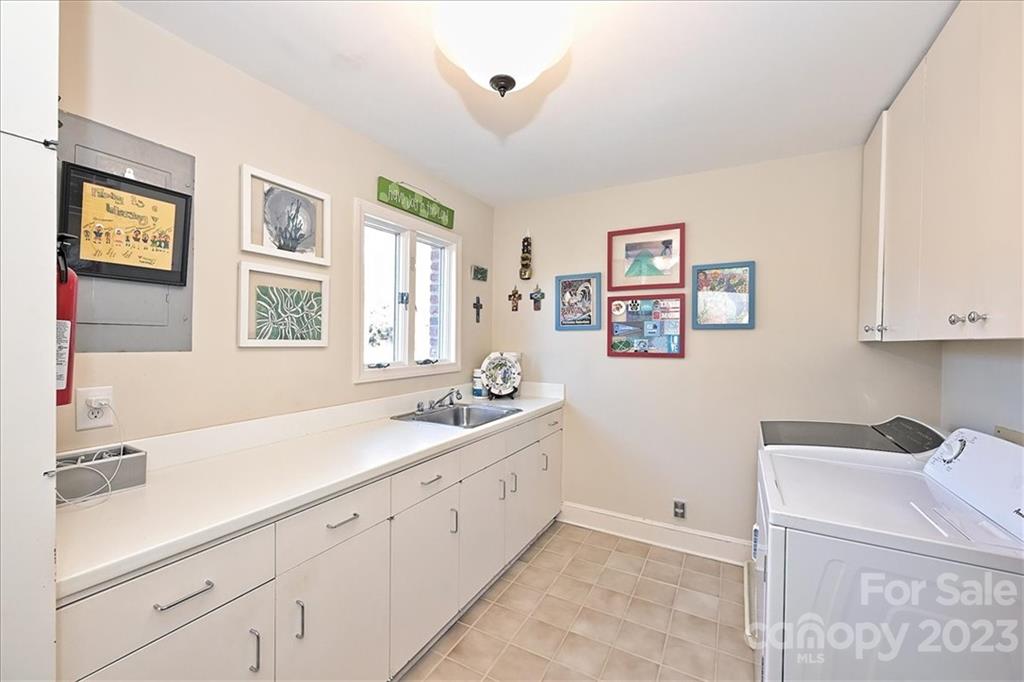 3724 Merrifield Road Charlotte, NC 28211 - Photo 18 of 48 a spacious bathroom with a double vanity sink a mirror and a window