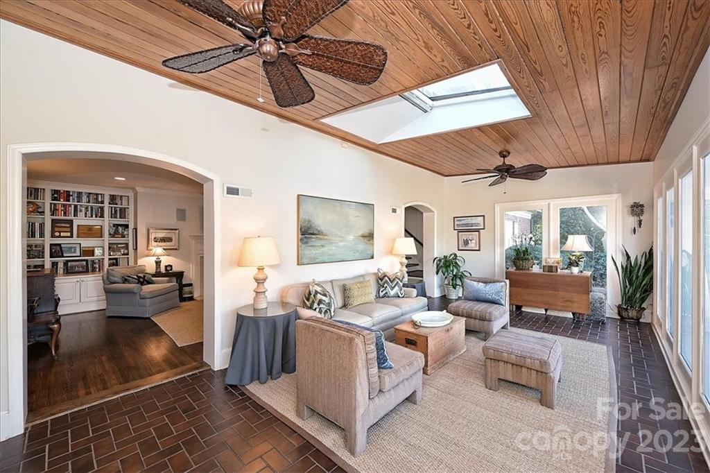 3724 Merrifield Road Charlotte, NC 28211 - Photo 24 of 48 a living room with patio furniture and a chandelier
