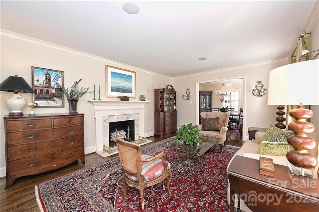 3724 Merrifield Road Charlotte, NC 28211 - Photo 5 of 48 a living room with furniture a fireplace and a flat screen tv