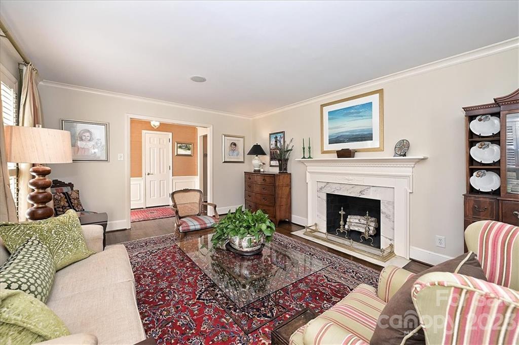 3724 Merrifield Road Charlotte, NC 28211 - Photo 6 of 48 a living room with furniture a flat screen tv and a fireplace