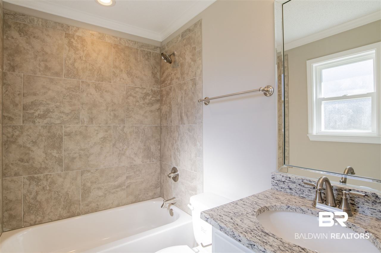 9141 Semmes Court Semmes, AL 36575 - Photo 16 of 28 Tile surround tub/shower combo.