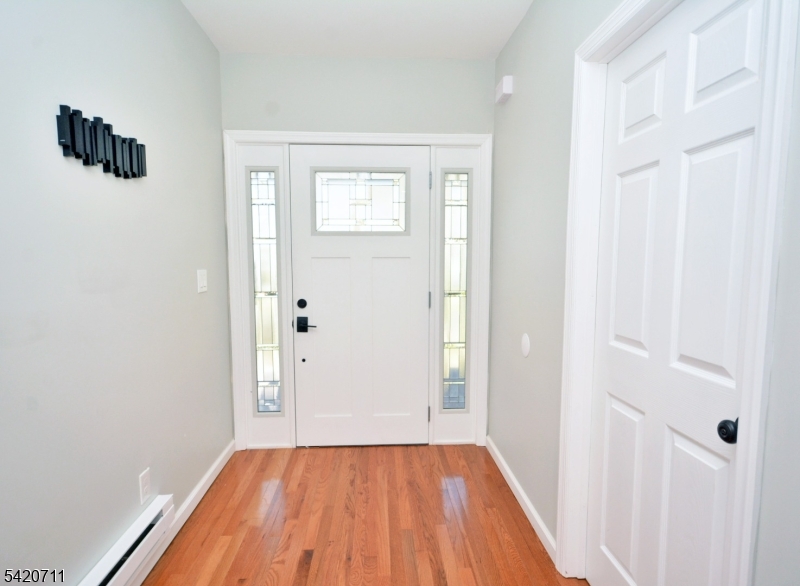 1324 George Street Plainfield, NJ 07062 - Photo 2 of 26 a view of a room that has a wooden floor in it