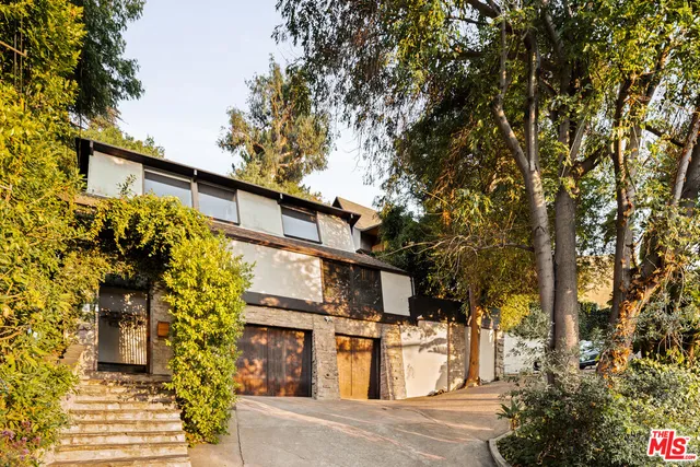 a house with trees in front of it