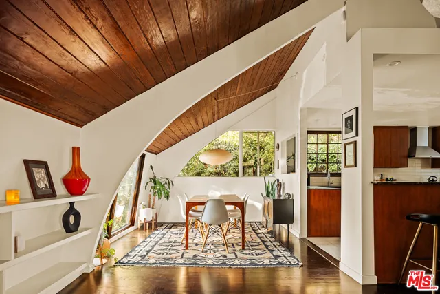 a view of living room with furniture and a window