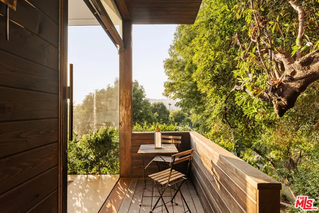 a view of balcony with furniture