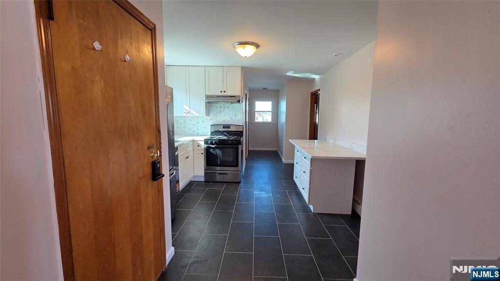 159-161 Tappan Street, Unit TOP Kearny, NJ 07032 - Photo 11 of 12 a view of a hallway with seating area