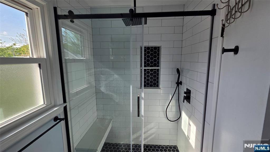 159-161 Tappan Street, Unit TOP Kearny, NJ 07032 - Photo 6 of 12 a bathroom with a glass shower door