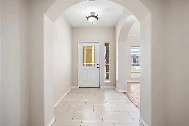 a view of an empty room with a fireplace