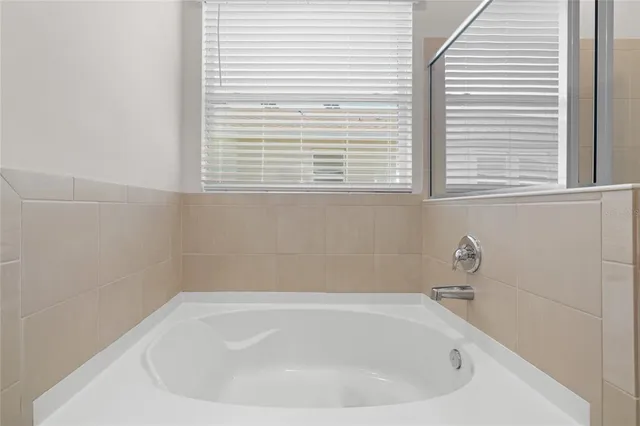 a white bath tub sitting in a bathroom