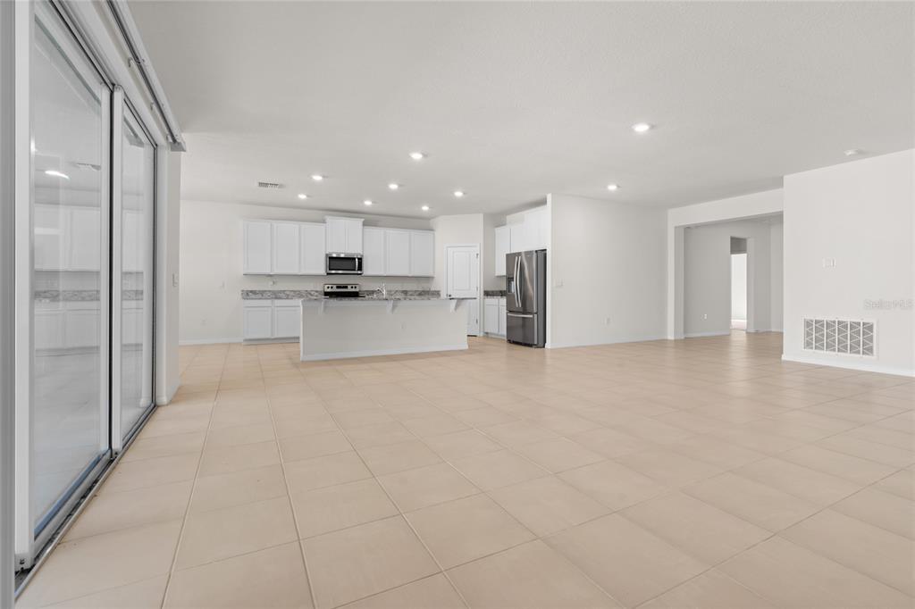 8260 Southwest 59th Avenue Ocala, FL 34476 - Photo 20 of 37 a view of a kitchen with a sink and a refrigerator