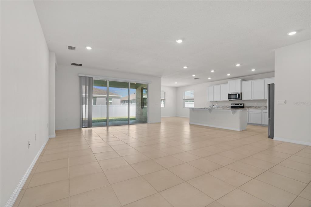 8260 Southwest 59th Avenue Ocala, FL 34476 - Photo 24 of 37 a view of an empty room with kitchen and window