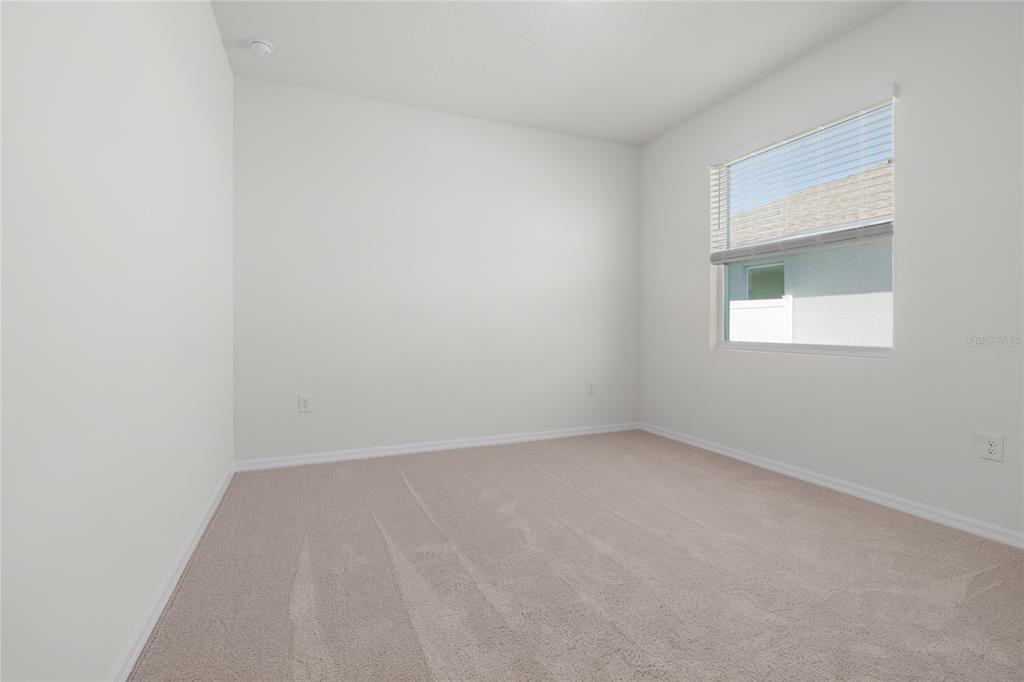 8260 Southwest 59th Avenue Ocala, FL 34476 - Photo 5 of 37 an empty room with a window