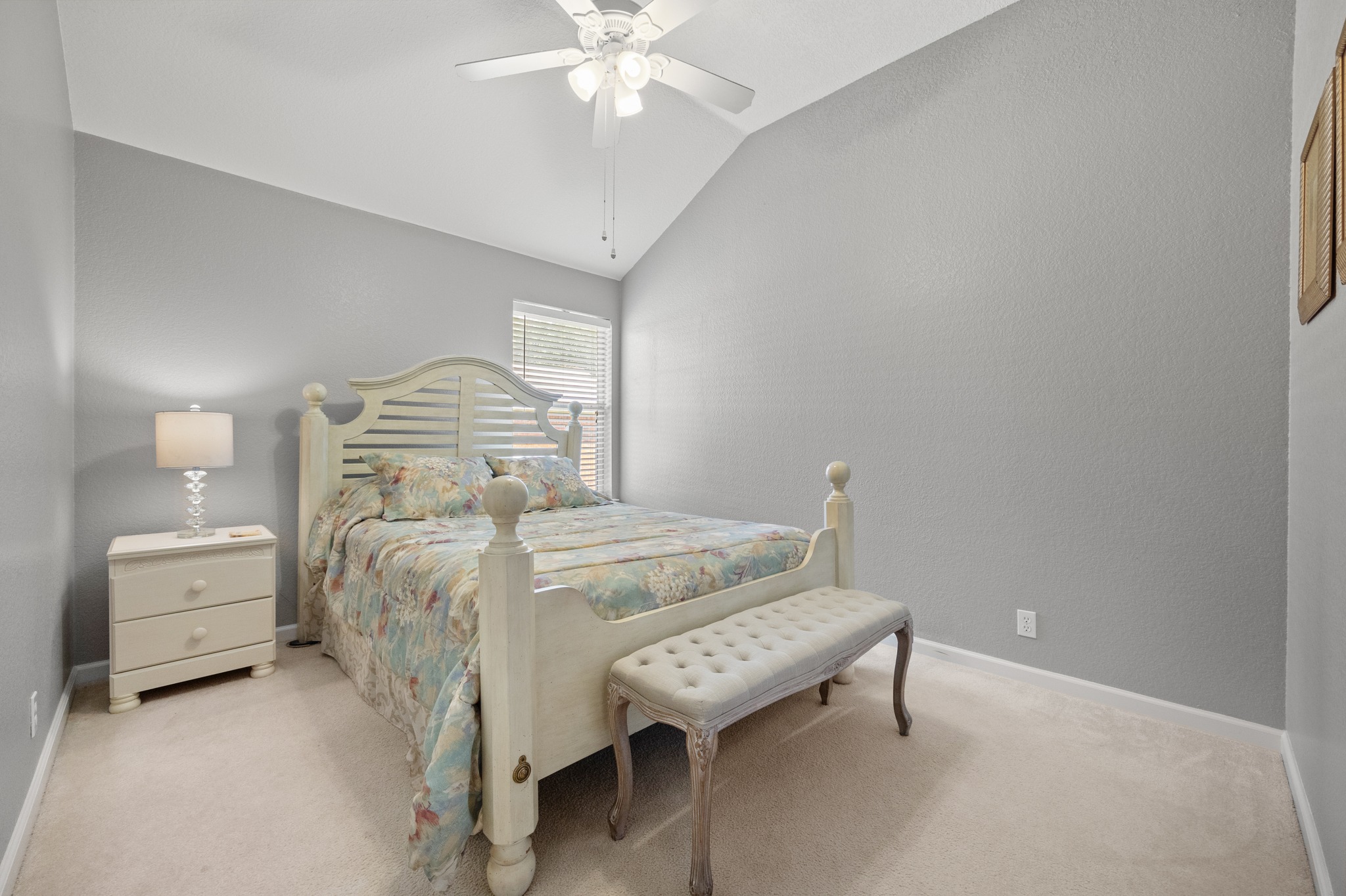 1108 Springbrook Road Pflugerville, TX 78660 - Photo 23 of 37 A comfortable bedroom with vaulted ceilings and a window providing natural illumination.