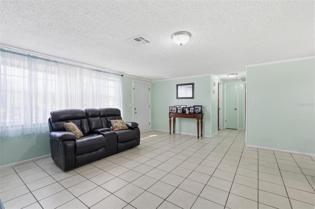 4904 Elmwood Street New Port Richey, FL 34653 - Photo 15 of 57 a living room with furniture