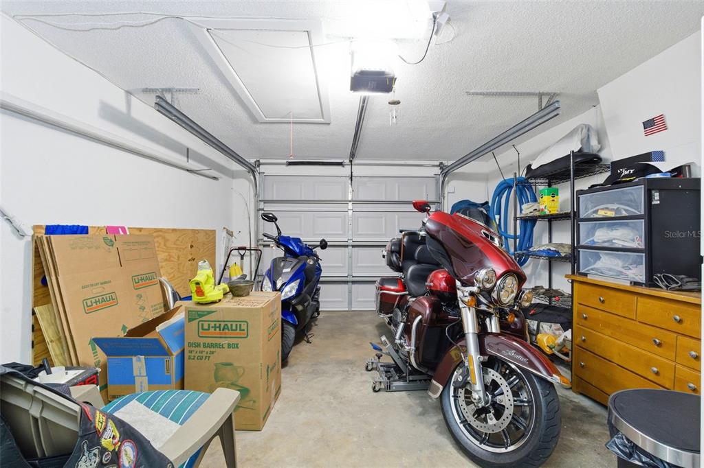4904 Elmwood Street New Port Richey, FL 34653 - Photo 26 of 57 a view of a storage room with a lot of stuff