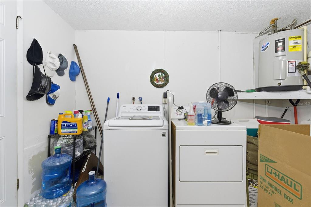 4904 Elmwood Street New Port Richey, FL 34653 - Photo 27 of 57 a view of storage and utility room