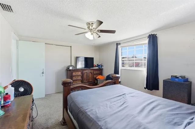 a bathroom with a toilet sink vanity and shower