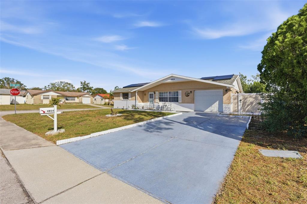 4904 Elmwood Street New Port Richey, FL 34653 - Photo 3 of 57 a view of a house with outdoor space