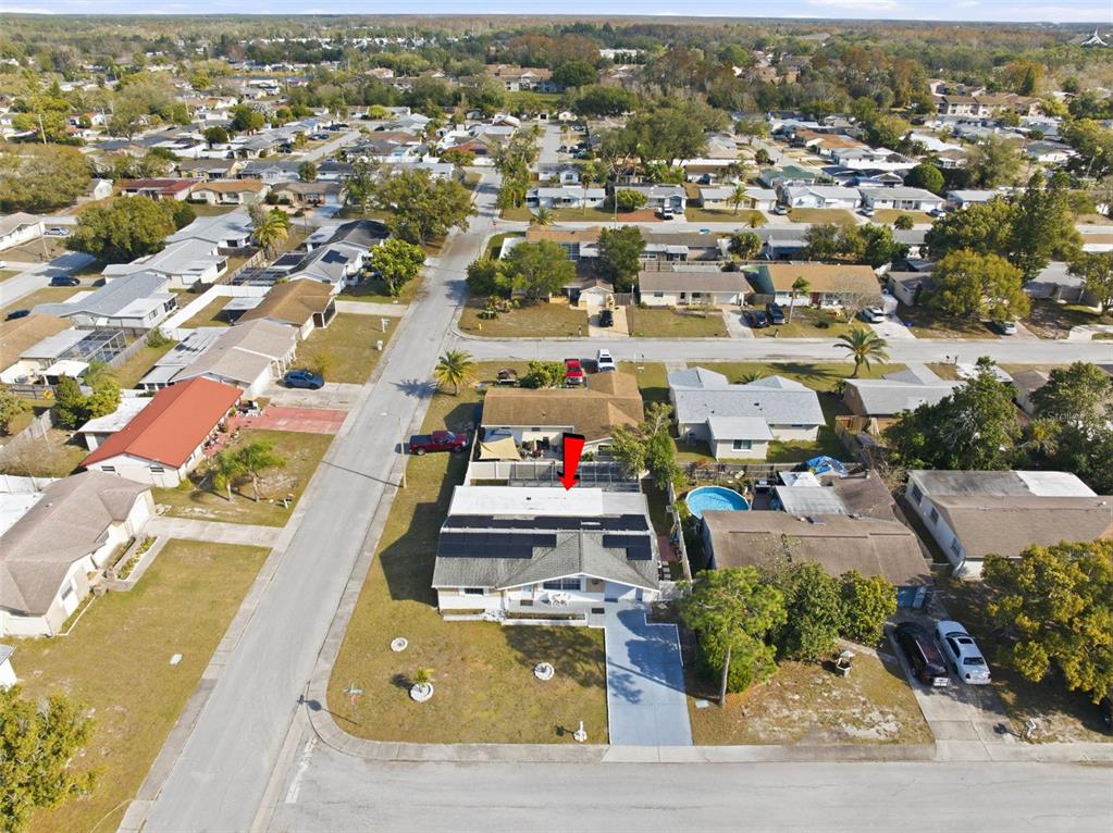 4904 Elmwood Street New Port Richey, FL 34653 - Photo 38 of 57 an aerial view of residential houses with outdoor space