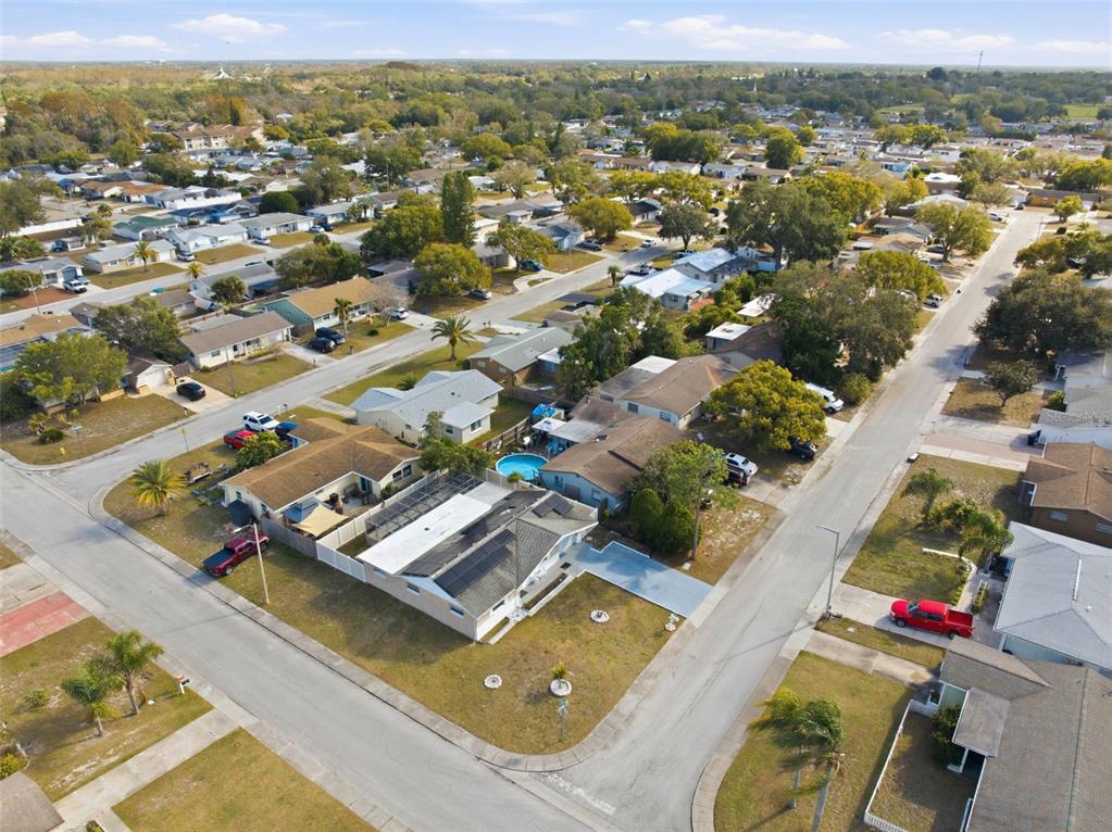 4904 Elmwood Street New Port Richey, FL 34653 - Photo 41 of 57 an aerial view of residential houses with outdoor space