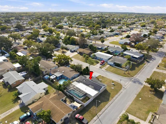 an aerial view of residential houses with outdoor space