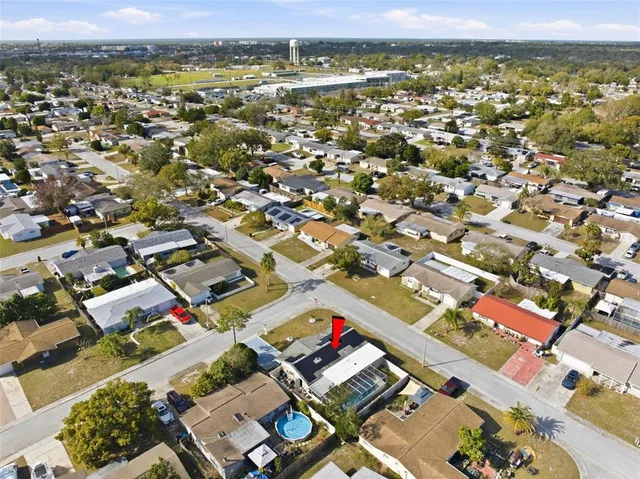 an aerial view of residential houses with outdoor space