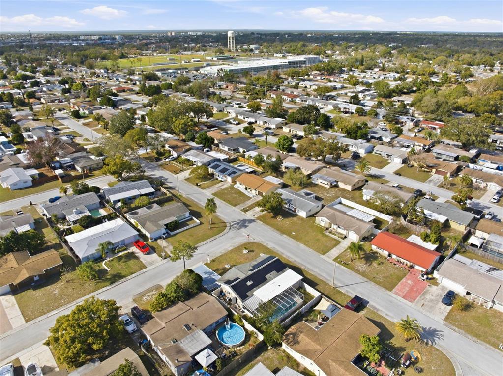 4904 Elmwood Street New Port Richey, FL 34653 - Photo 49 of 57 an aerial view of residential houses with outdoor space