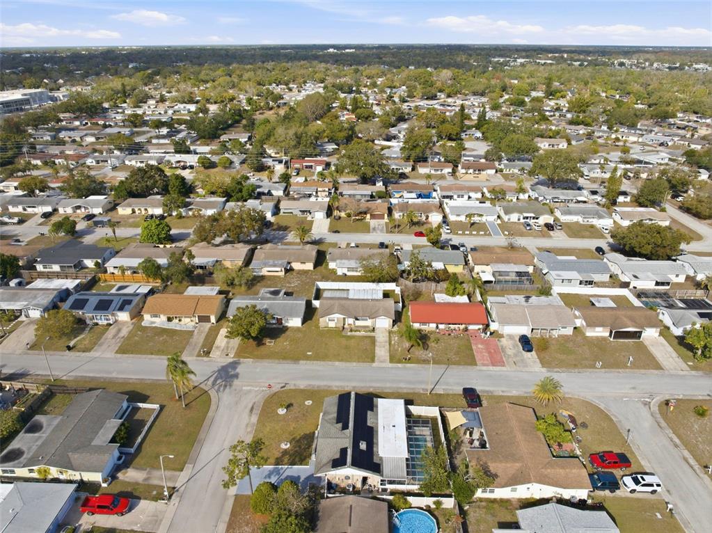 4904 Elmwood Street New Port Richey, FL 34653 - Photo 51 of 57 an aerial view of residential houses with outdoor space