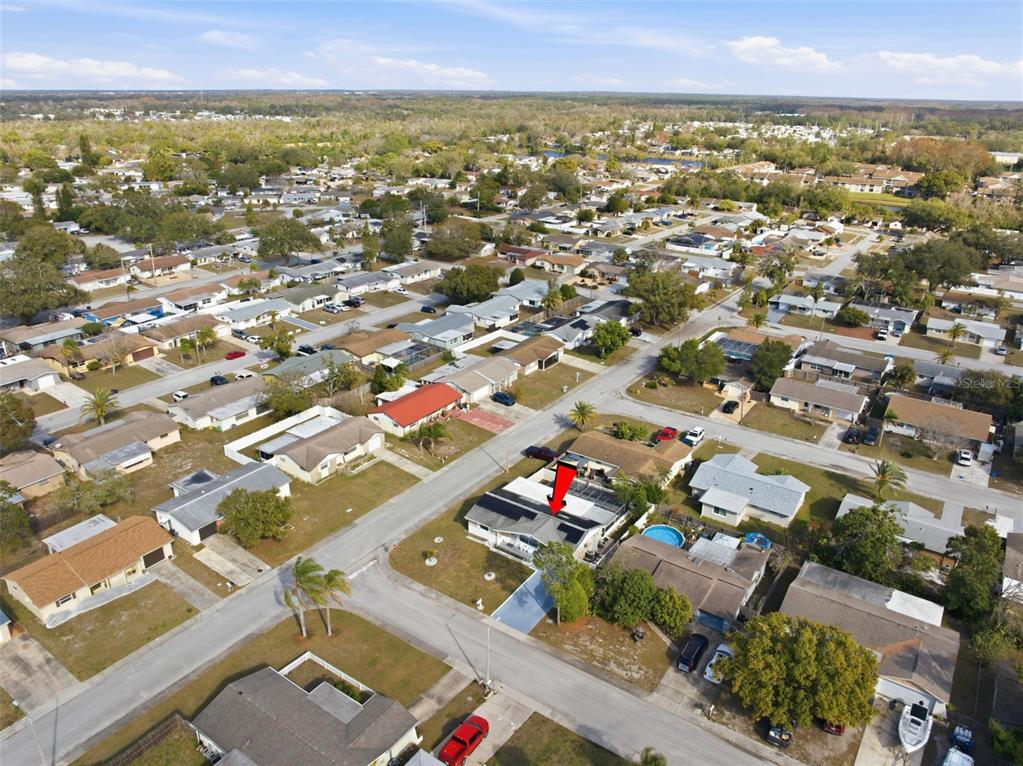 4904 Elmwood Street New Port Richey, FL 34653 - Photo 52 of 57 an aerial view of residential houses with outdoor space
