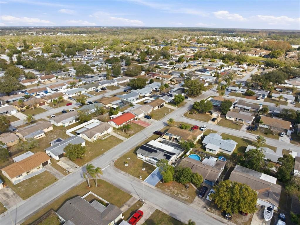 4904 Elmwood Street New Port Richey, FL 34653 - Photo 53 of 57 an aerial view of residential houses with outdoor space