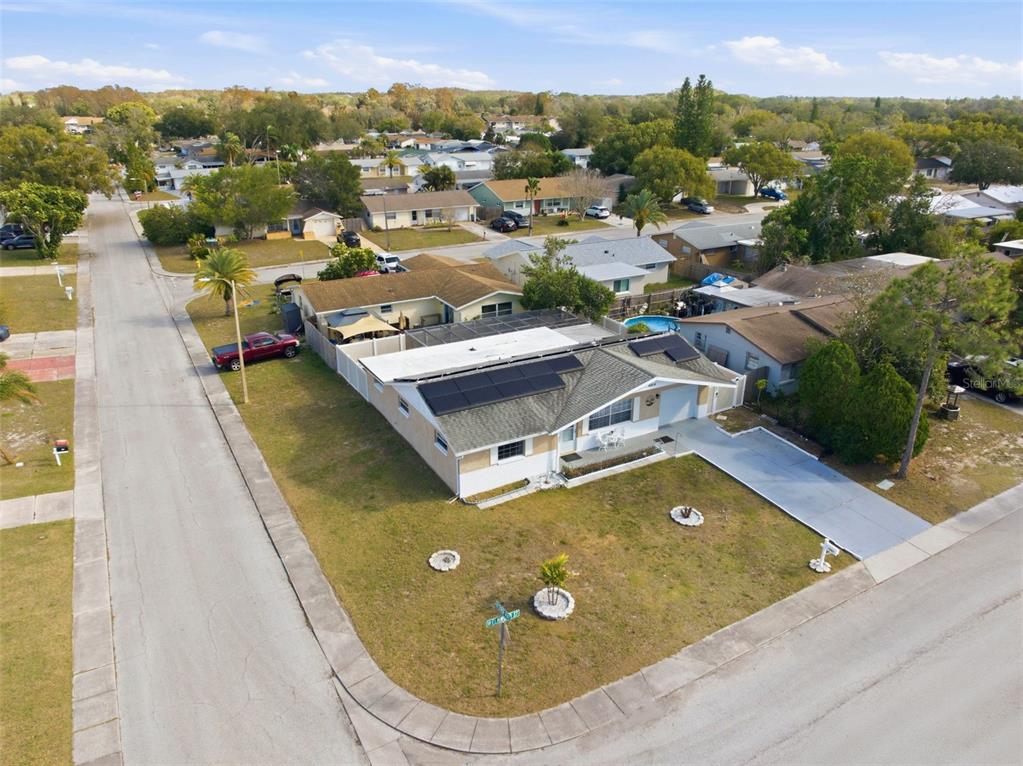 4904 Elmwood Street New Port Richey, FL 34653 - Photo 54 of 57 an aerial view of a house with swimming pool and mountains