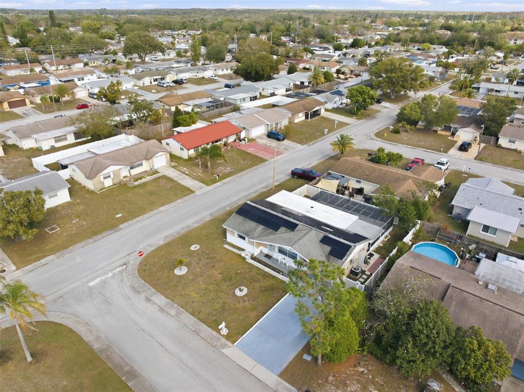 4904 Elmwood Street New Port Richey, FL 34653 - Photo 57 of 57 an aerial view of residential houses with outdoor space