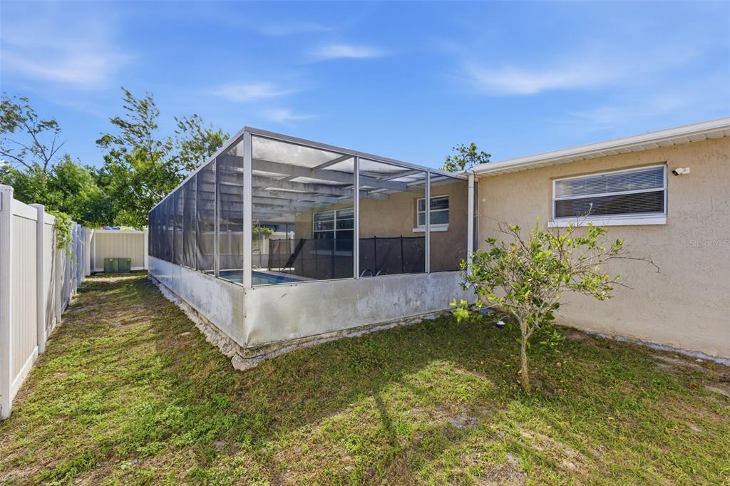 4904 Elmwood Street New Port Richey, FL 34653 - Photo 7 of 57 a house with swimming pool