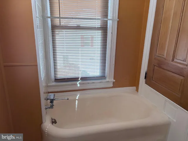 an empty room with fan