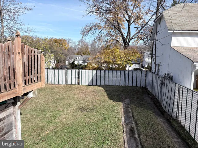 a view of balcony with wooden fence