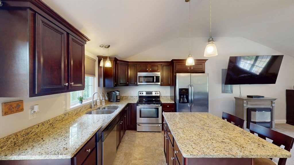53 Walker Road Shirley, MA 01464 - Photo 12 of 29 a large kitchen with granite countertop a large counter top appliances and cabinets