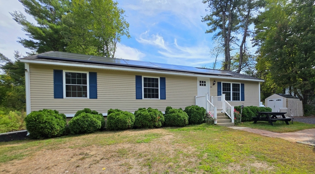 53 Walker Road Shirley, MA 01464 - Photo 2 of 29 a view of a house with backyard and garden