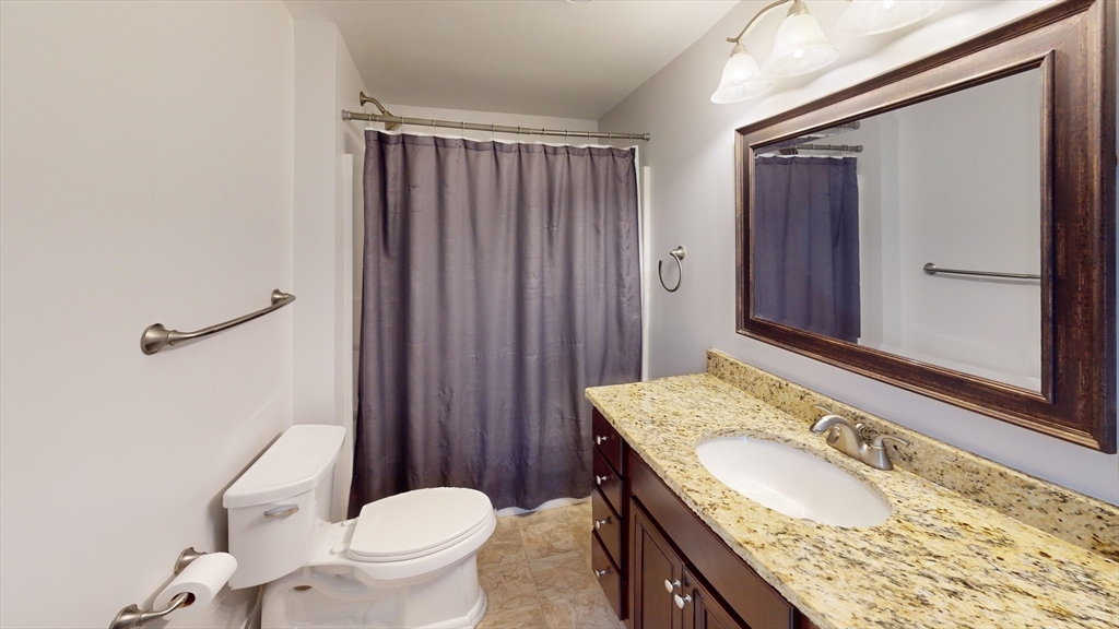 53 Walker Road Shirley, MA 01464 - Photo 24 of 29 a bathroom with a granite countertop sink toilet and shower