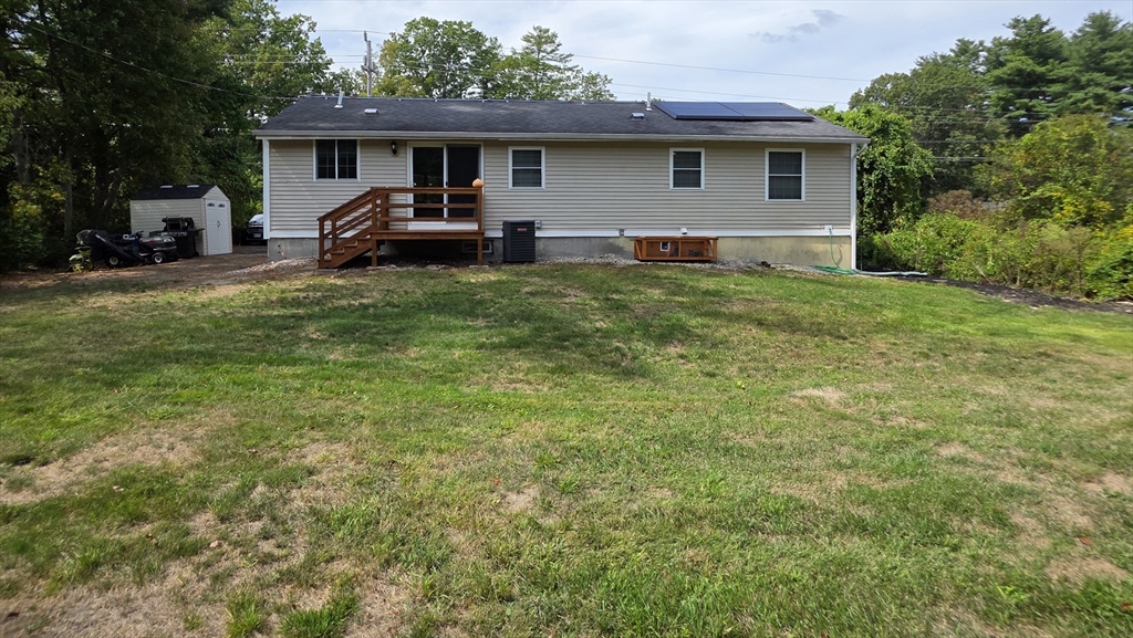 53 Walker Road Shirley, MA 01464 - Photo 4 of 29 a front view of house with yard and green space