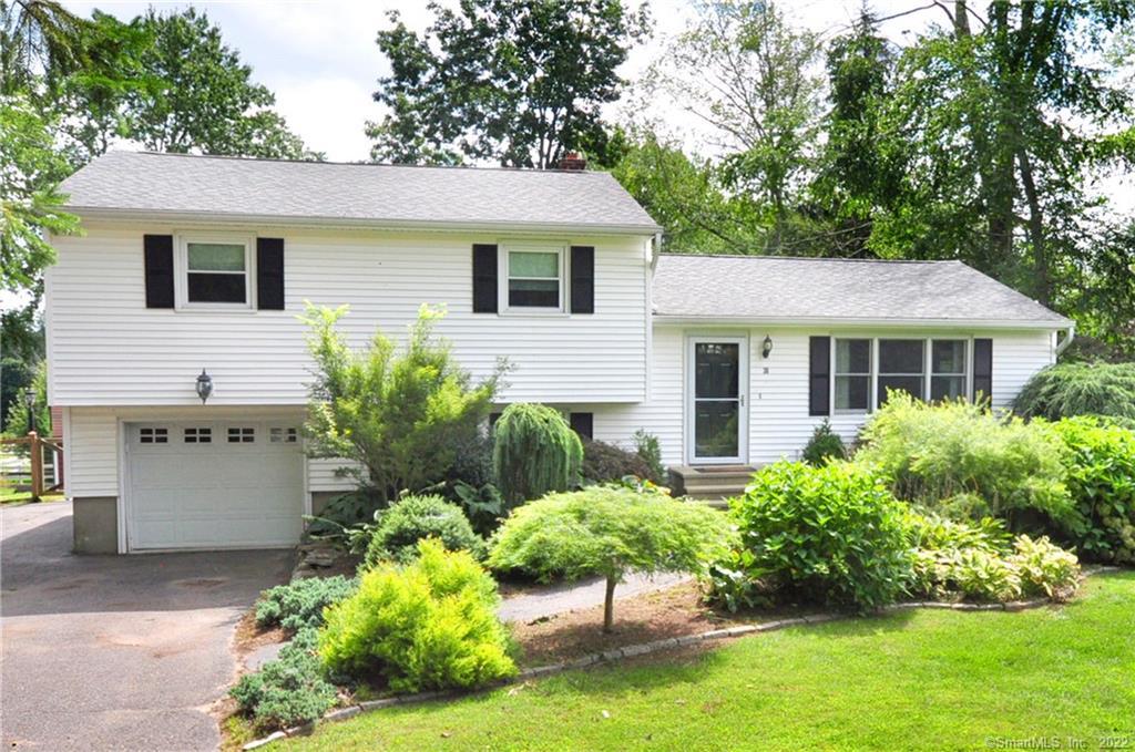 Fabulous curb appeal with level driveway and ample parking