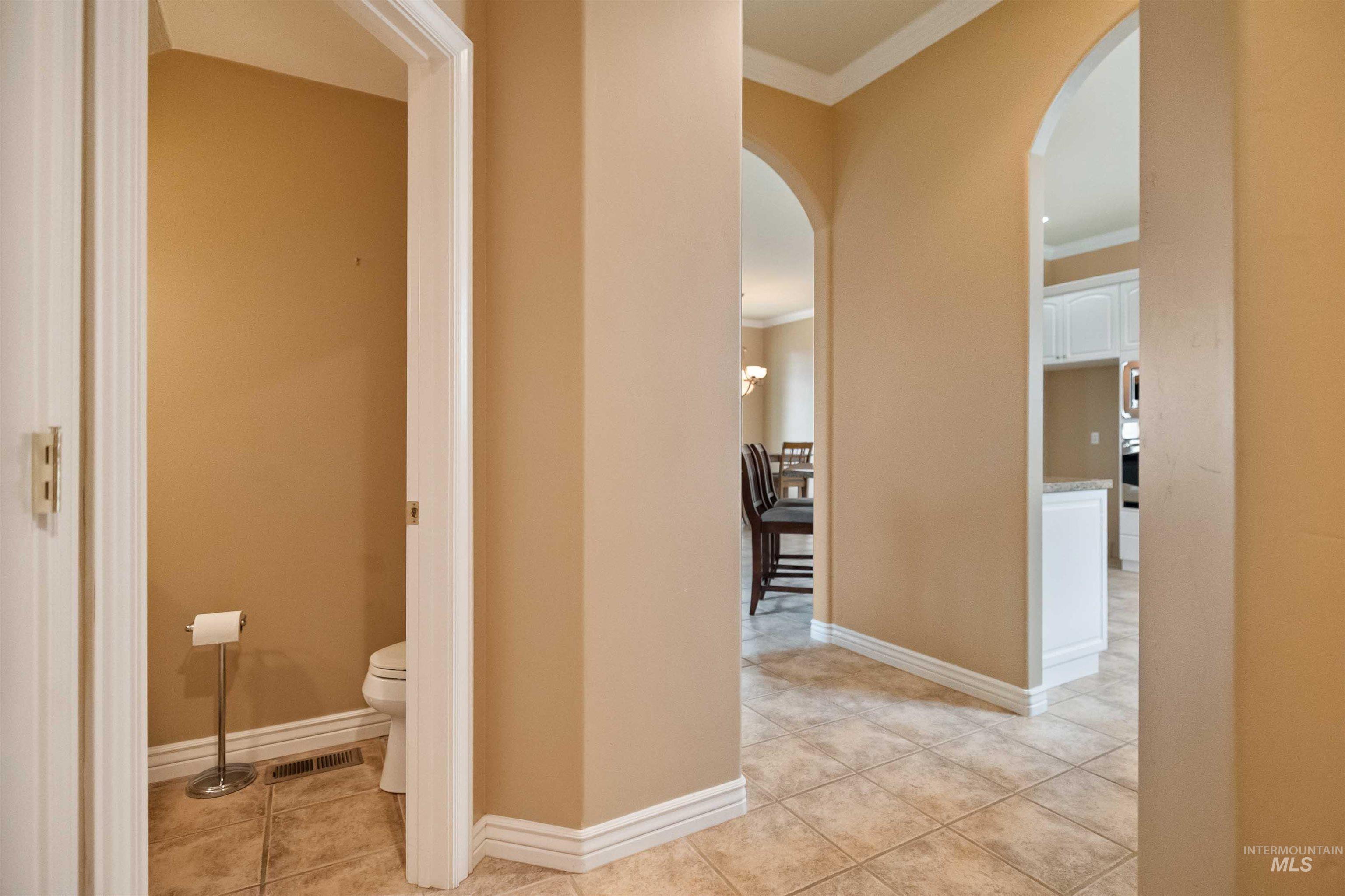 3404 Ridge Line Drive Kimberly, ID 83341 - Photo 32 of 50 Interior archways, crown molding, and tile flooring