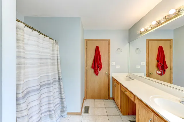 a bathroom with a tub and a sink