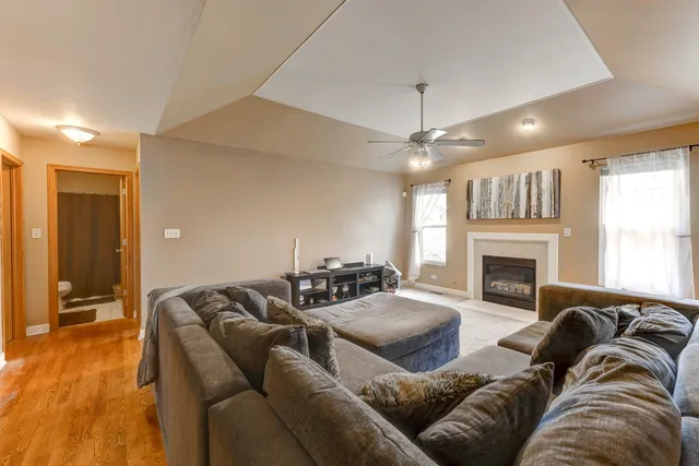 a living room with furniture and a fireplace