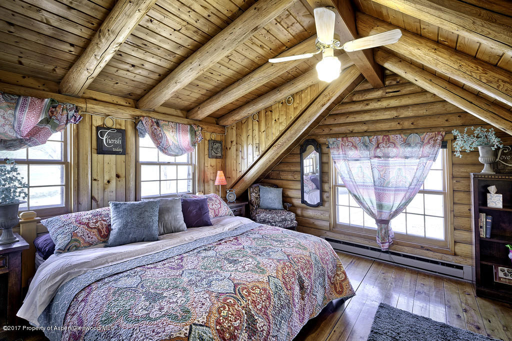 349 Spruce Creek Road Rifle, CO 81650 - Photo 10 of 20 second bedroom with vaulted ceiling