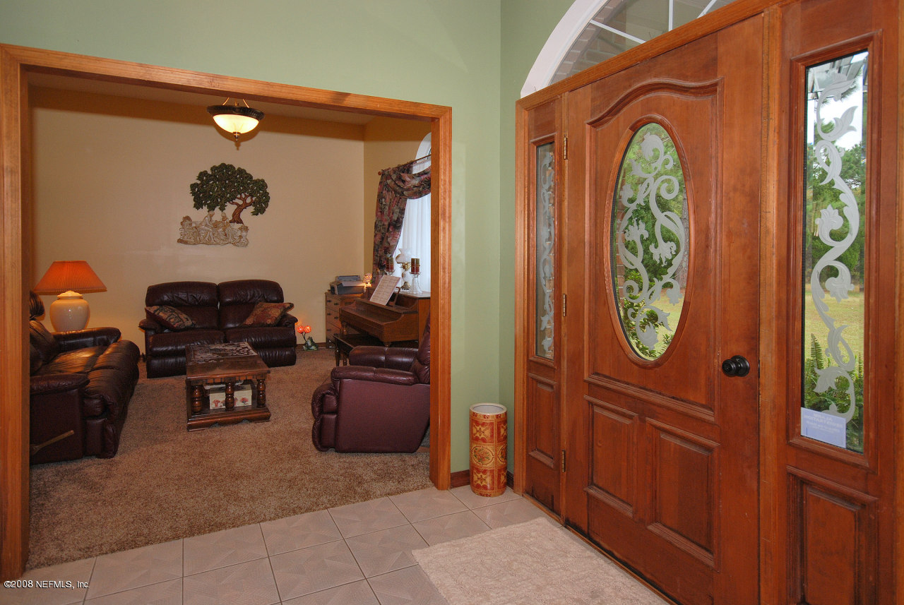 15591 Flounder Road Jacksonville, FL 32226 - Photo 8 of 12 a front view of a house with entryway and wooden closet