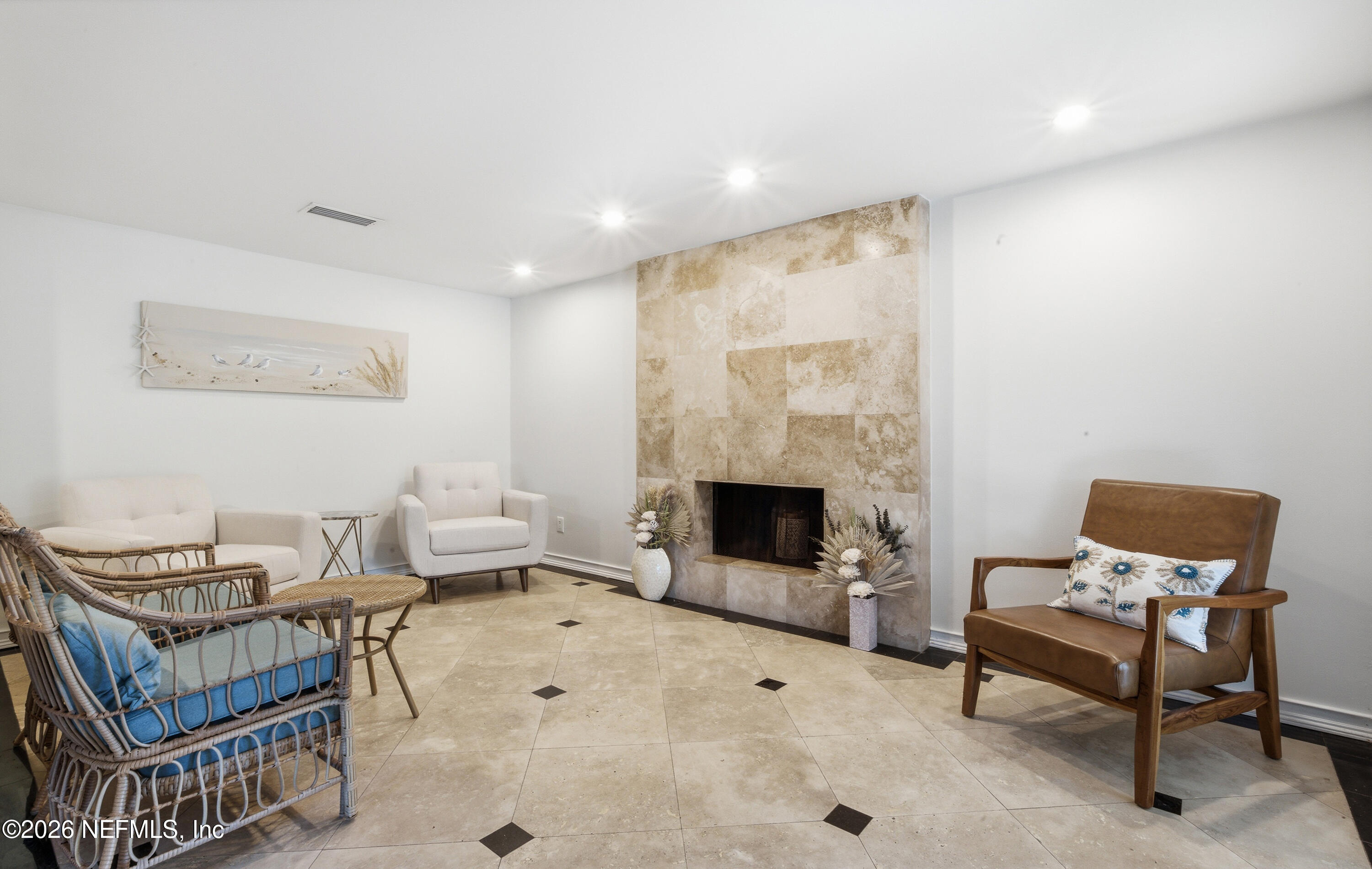 147 Knight Boxx Road Middleburg, FL 32068 - Photo 10 of 30 a living room with furniture a rug and a fireplace