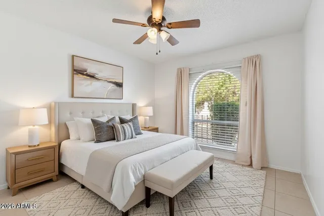 a dining room with stainless steel appliances kitchen island granite countertop a sink dishwasher a dining table and chairs with wooden floor